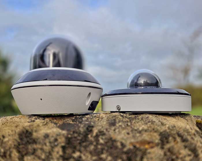 A Hikvision and a Dahua mini PTZ camera side by side for size