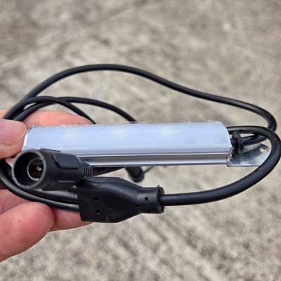 A Green Feathers daytime LED lamp for bird boxes, with its own built in photocell