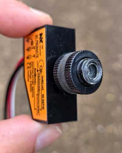 A separate photocell switch used to turn a nest box light on in daylight