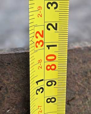 Tape measure showing the height of an oak whisky barrel